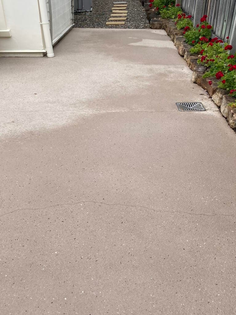 Concrete courtyard after cleaning, lighter and more even